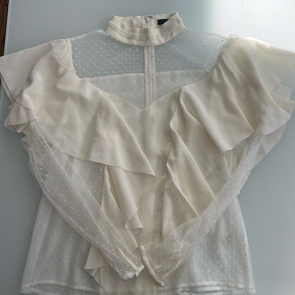 Chelsea and Walker Cream ruffled top